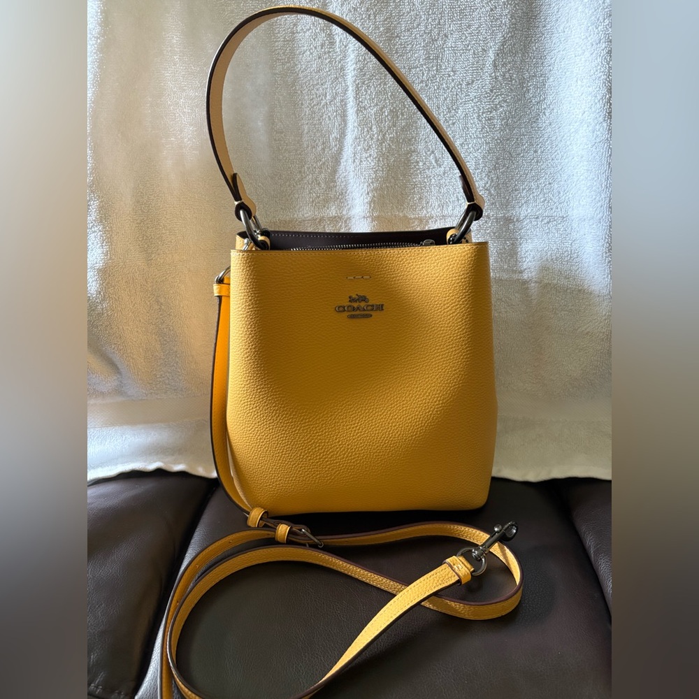 Coach Small Town Bucket Bag
Mustard Pebbled Leather - gently used
